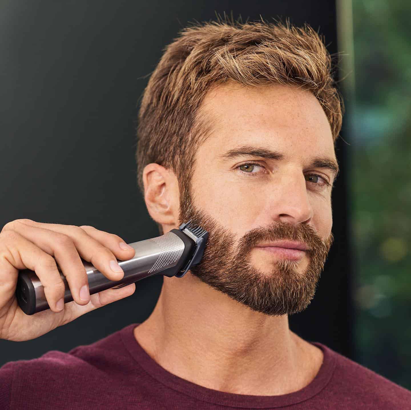 man using a philips norelco multigroom clippers