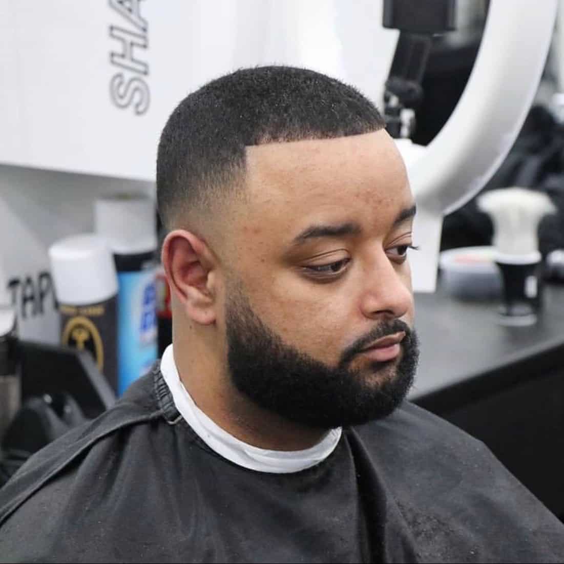 man with a number 3 against the grain with skin fade haircut