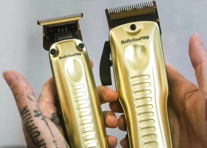 holding two babyliss pro gold lo pro fx