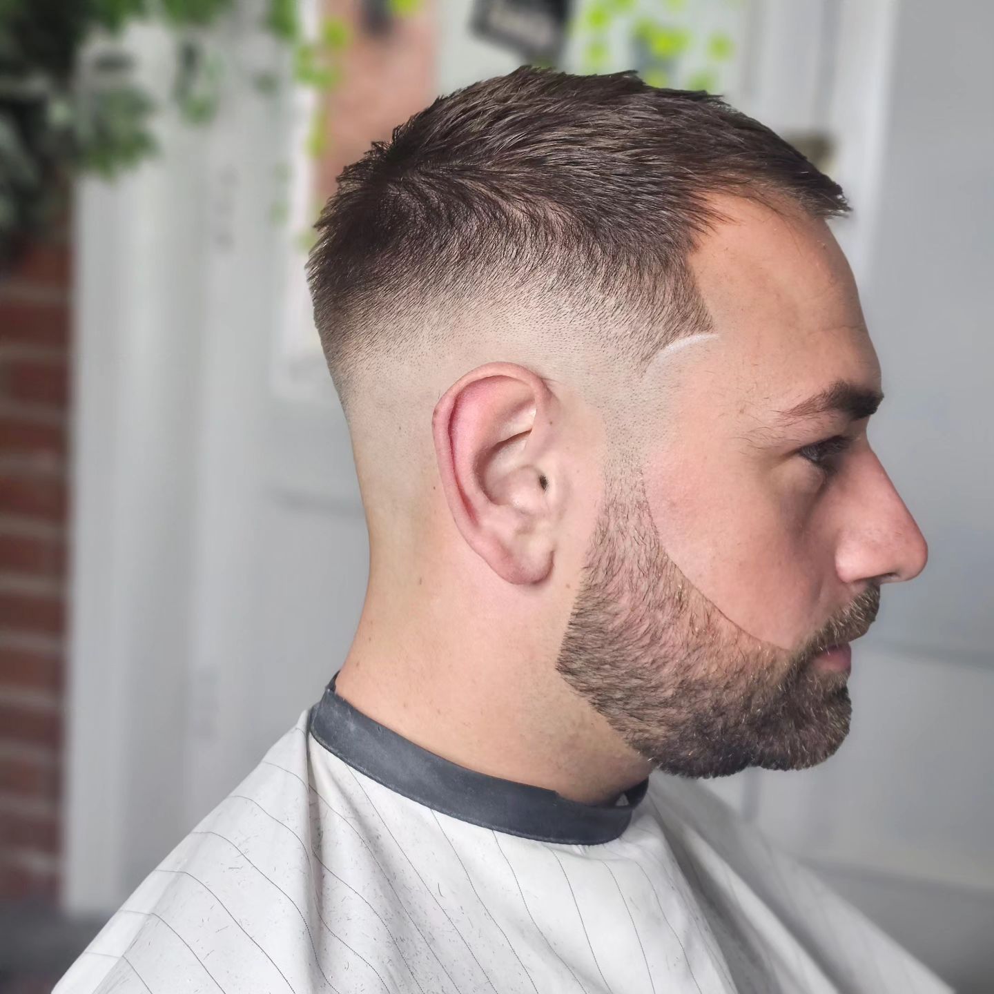 mid fade haircut with beard trim