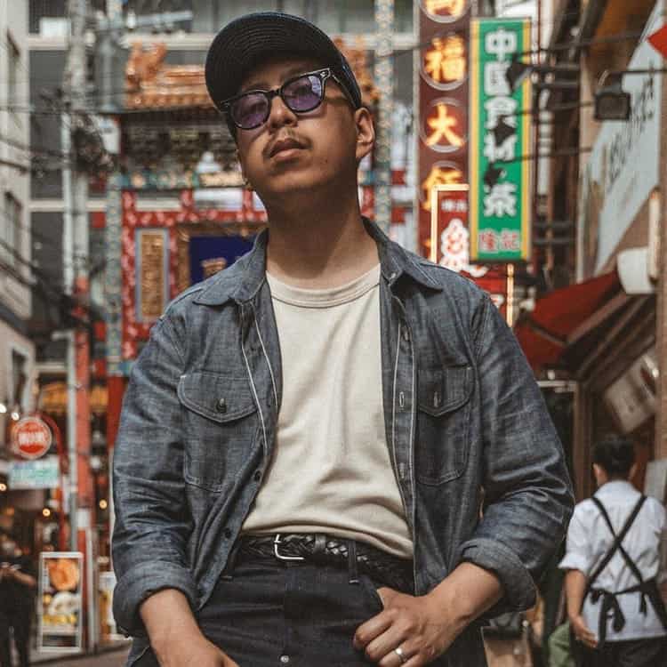 man wearing denim shirt and jeans