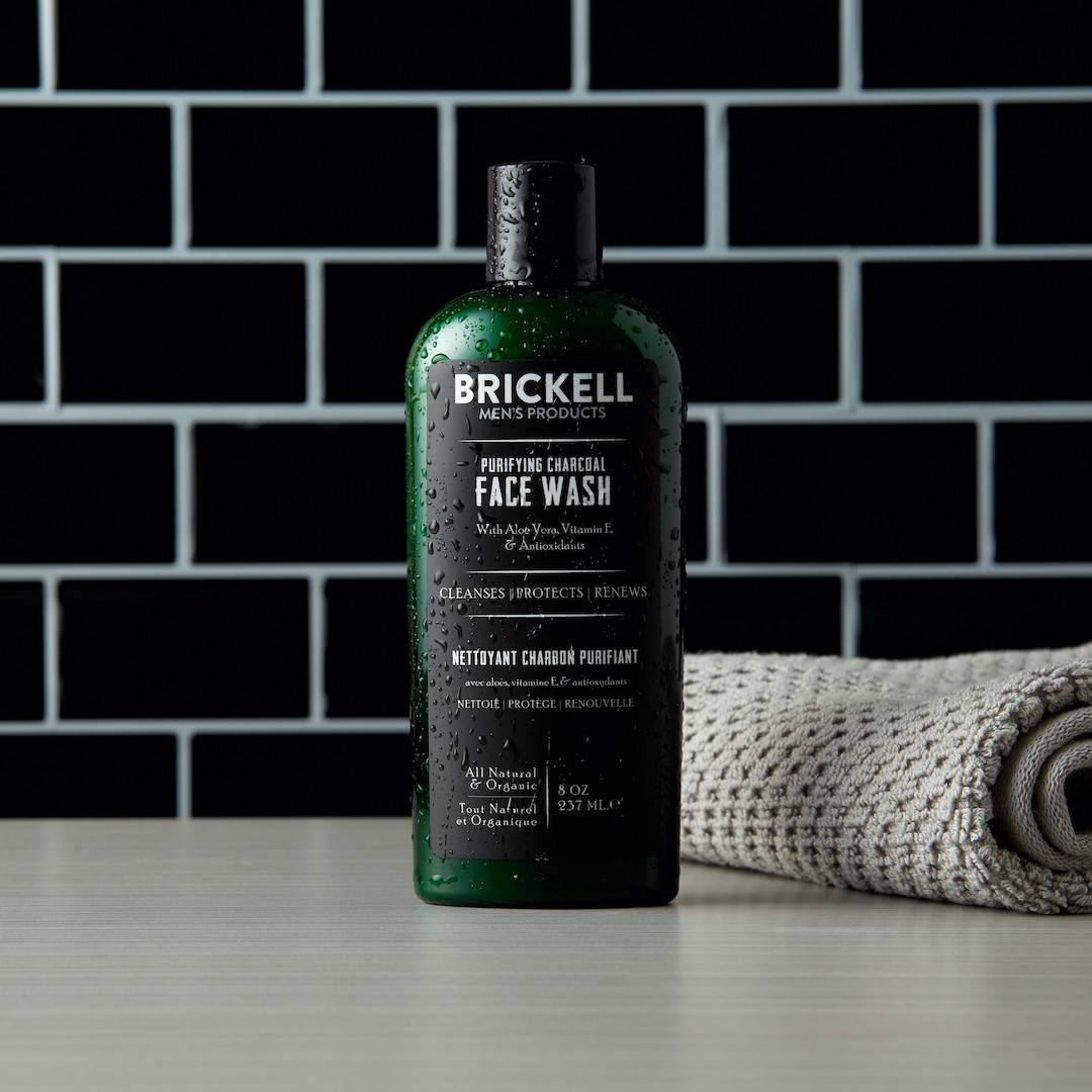 a bottle of purifying charcoal face wash by brickell