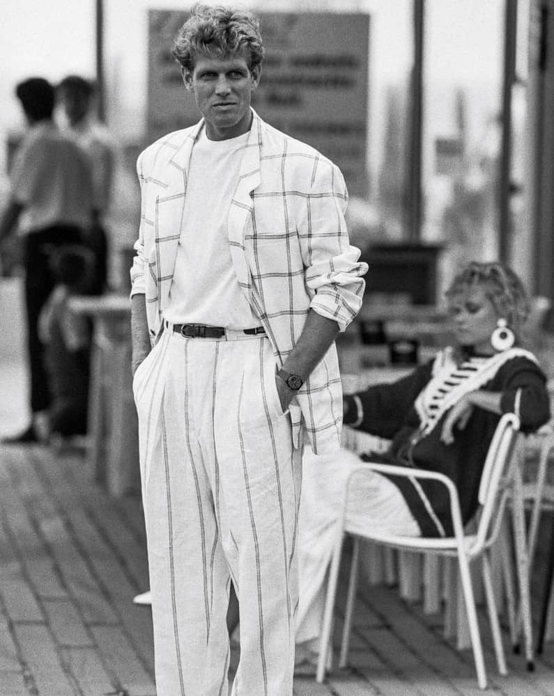 A man in 1980s wearing an oversized blazer