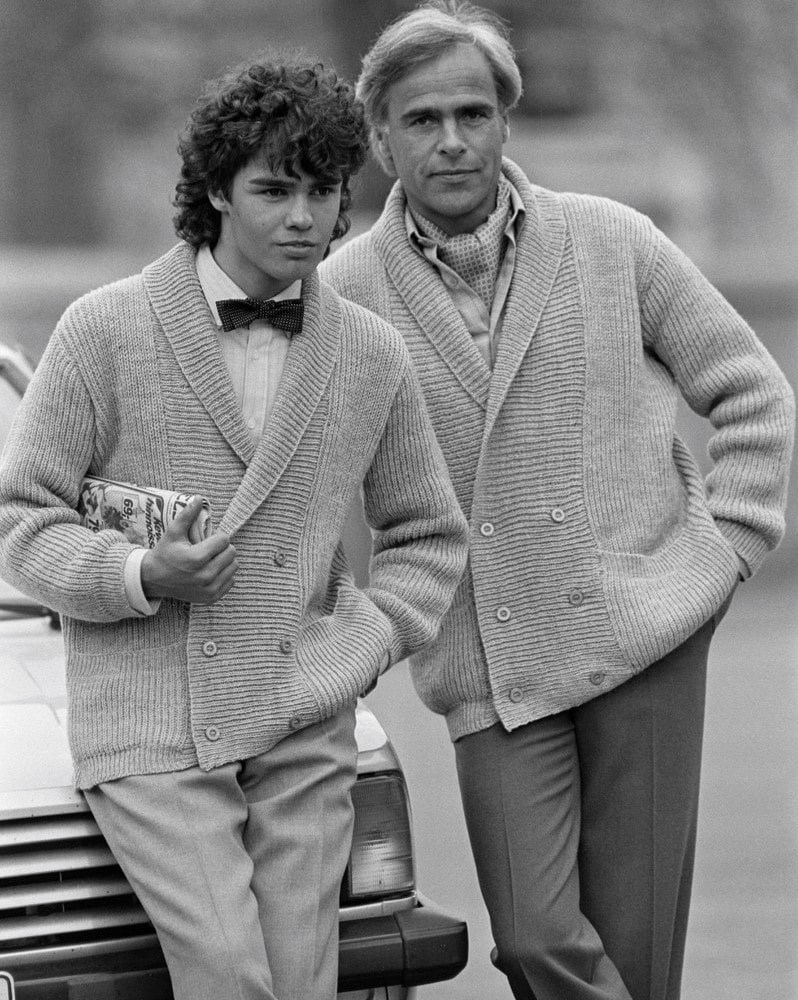 two men in 1980s wearing cardigans
