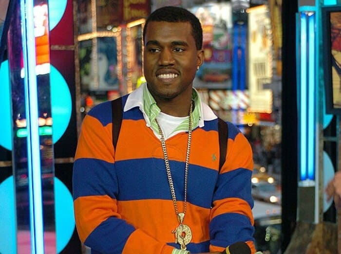 kayne west wearing a sweater over a shirt