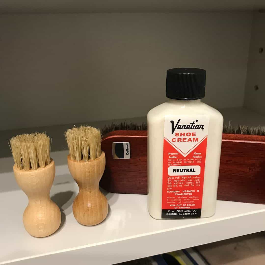 a bottle of venetian shoe cream and shoe brushes