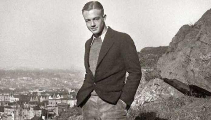 man in 1950s wearing a blazer over a sweater