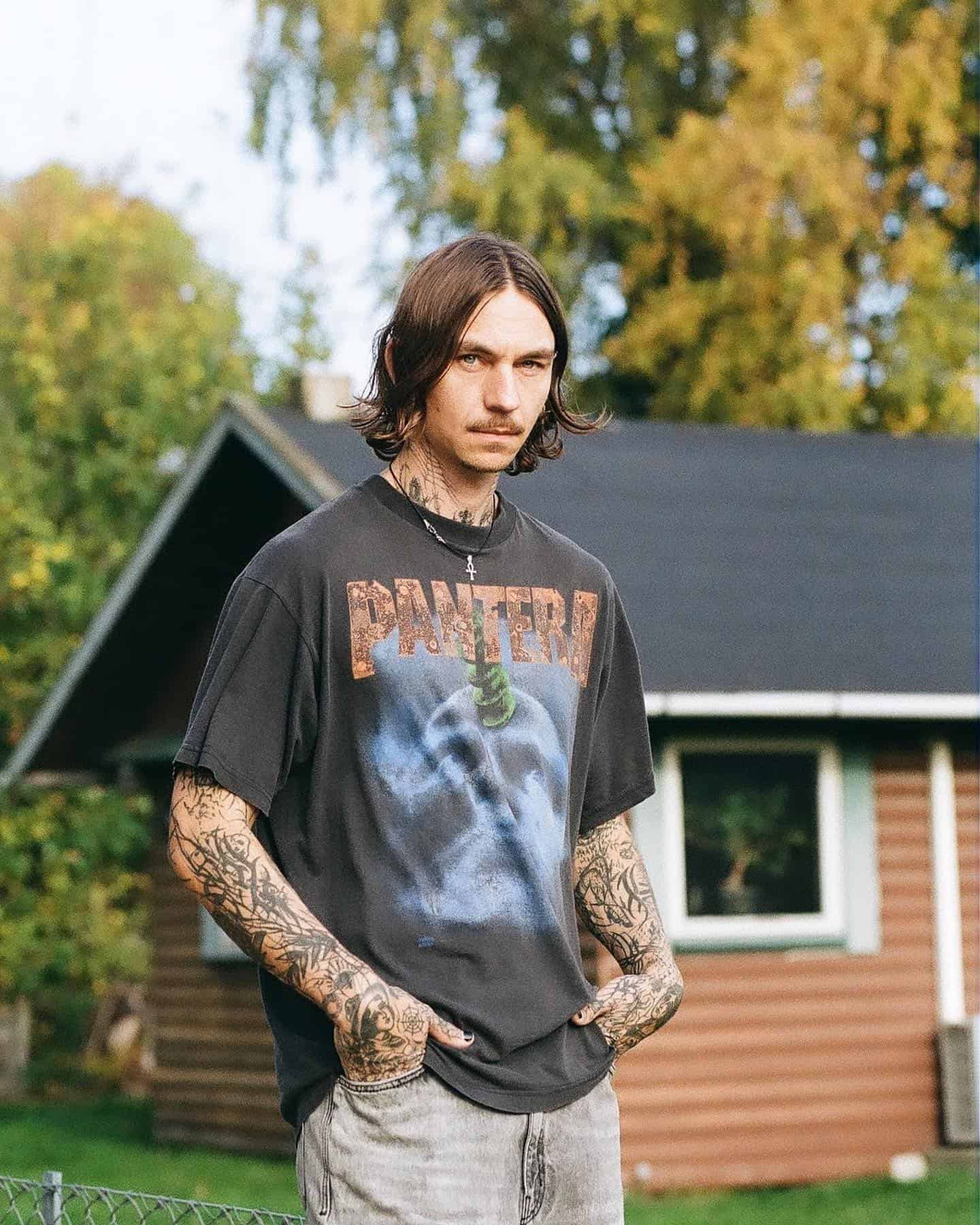 man wearing a black shirt with pantera print