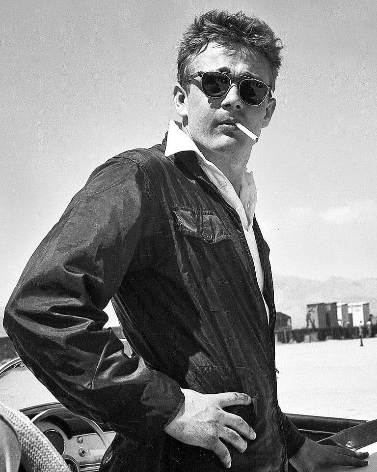 james dean wearing a light jacket with cigarette in mouth