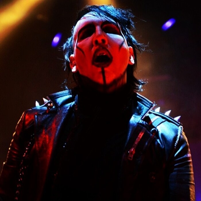 rock musician marilyn manson in a black leather jacket